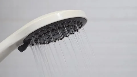 Closeup view of bathroom hand shower with water stream. Slow motion video. Stock Footage 282907520