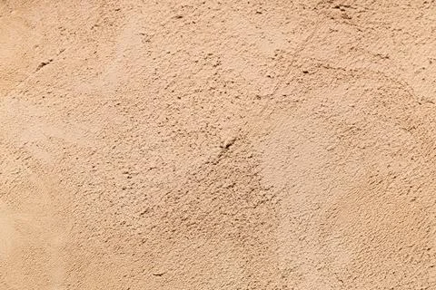 Closeup view of beige clay surface as background Stock Photos