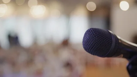 Closeup view of black microphone in light interior of wedding hall. Stock Footage 119480815