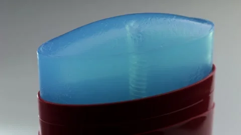 A closeup view of a blue stick deodorant that highlights its incredibly smooth Stock Footage 306064636