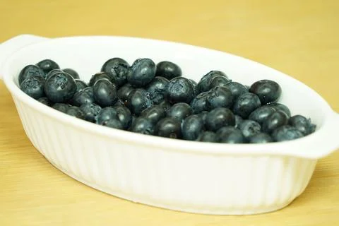 Closeup view of Blueberries in a plate on the table Stock Photos