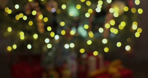 Closeup view of blurry defocused bokeh of green Christmas tree decorated and Stock Footage 221484150
