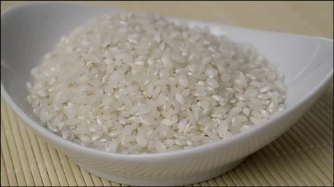 Closeup view of bowl full of rice rotating Stock Footage 72135672