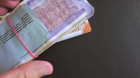 Closeup view of brand new 100 and 200 indian rupee (INR) banknotes stack. Stock Footage 296844012