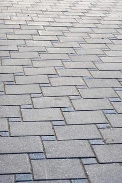 A closeup view of a brick pavement with a diagonal pattern Stock Photos