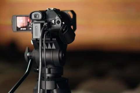 Closeup view of broadcasting camera with external screen Stock Photos