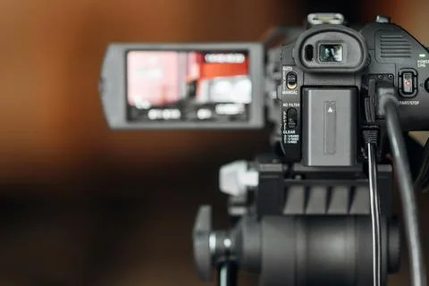 Closeup view of broadcasting camera with external screen Stock Photos