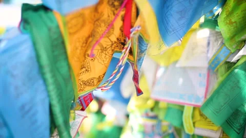 Closeup view of a buddhist multicolored headscarves - khadakas. Cultural Stock Footage 154268537