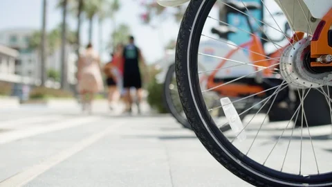 Closeup view of bycicle wheel in sharing point Stock Footage 112757404
