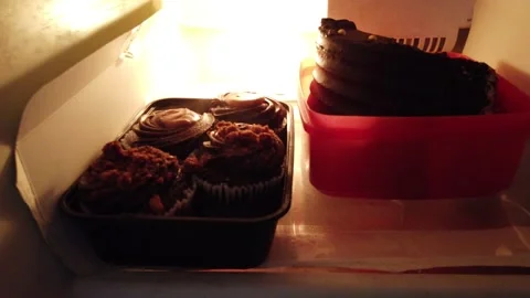 Closeup view of cakes in fridge to long shot of complete fridge Stock Footage 137228257