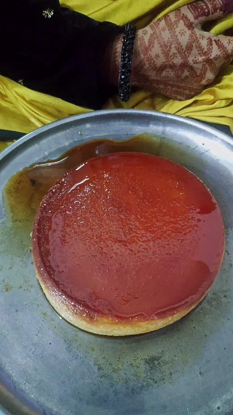 Closeup view of caramel flan dessert showing smooth texture and glossy cara.. Stock Footage 339080815