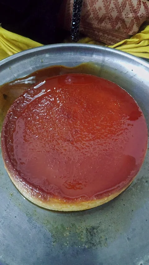 Closeup view of caramel flan dessert showing smooth texture and glossy cara.. Stock Footage 339080816