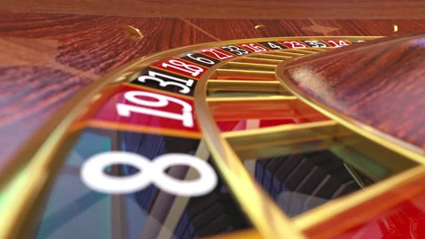 Closeup view at casino roulette table with rotating wooden roulette wheel Stock Footage 163539887
