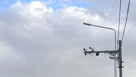 Closeup view of CCTV cameras mounted on poles in big city outdoors. Stock Footage 157942676