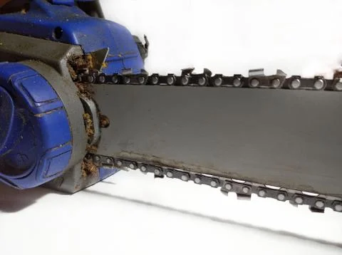  Closeup view of a chainsaw bar and cutting chain. Dirty blade of a chainsaw. Bl Stock Photos