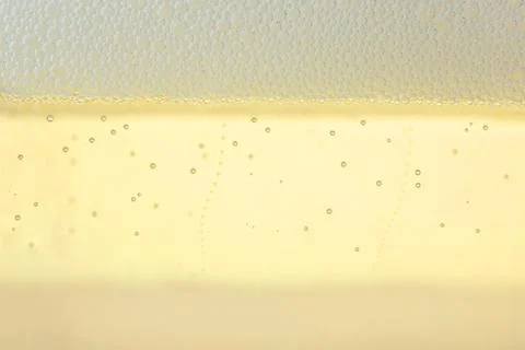 Closeup view of champagne with bubbles as background Stock Photos
