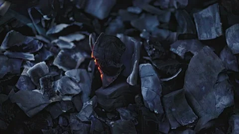 A CloseUp View of Charred Coal and Glowing Embers, Showcasing Their Captivating Stock Footage 312076312