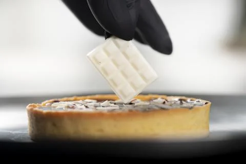 Closeup view of the chef decorating the cake Stock Photos