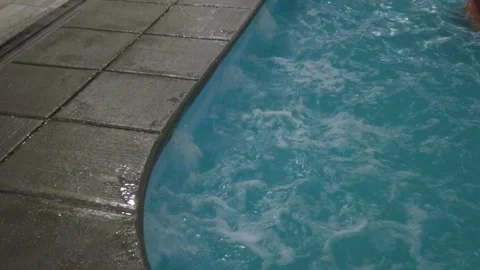 Closeup View of Clear Indoor Pool Water With Swimmer in Corner Stock Footage 301713264
