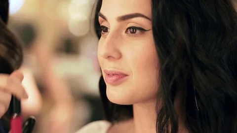 Closeup view of a client choosing a shade of lipstick for her sexy lips Stock Footage 76086060