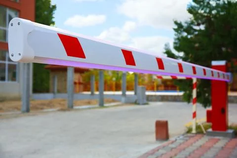 Closeup view of closed automatic boom barrier outdoors, space for text Stock Photos