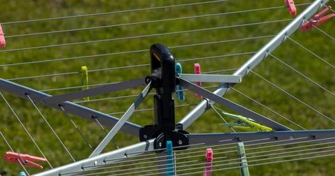 Closeup view of clothes hanger on a drying rack. Stock Photos