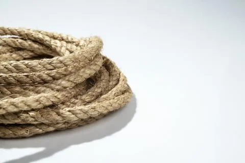 Closeup view of coiled ropes string isolated over a white background Foto stock