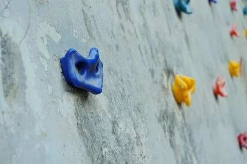 Closeup view of colorful plastic handholds on a climbing wall Stock-Fotos