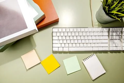 Closeup view of computer keyboard and an empty notebook and note paper 写真素材