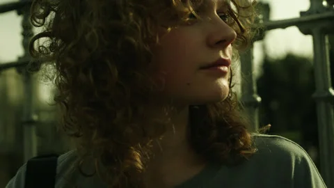 Closeup view of confident pretty young woman looking over the shoulder to the Stock Footage 271305159