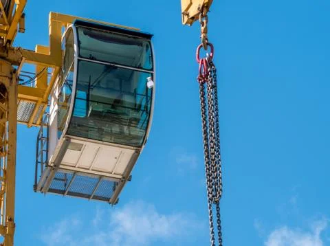 Closeup view of the control cabin of a construction tower crane. Construction Stock Photos