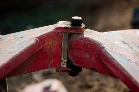 A closeup view of the coupling on a disc harrow for cultivating land Stock Photos