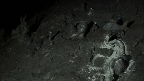Closeup view of crumbled statues which are located in a dark cave. Stock Footage 132962359