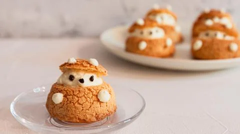 Closeup View Of Cute Bear Shape Choux Pastry, Cream Puff In A Glass Plate Stock Photos