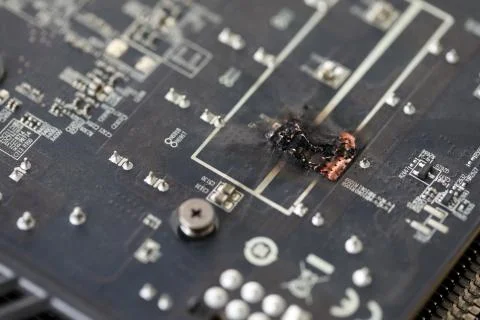 Closeup view of damaged graphic adapter burnt out after hack Stock Photos