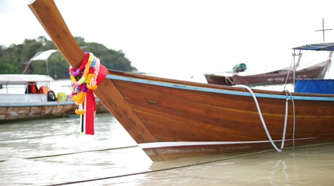 Closeup view of decorated longtail boat moored at the sandy beach, Krabi Stock Footage 61537872