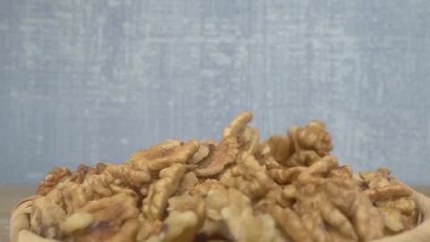 A CloseUp View of Delicious, Fresh Walnut Kernels Beautifully Arranged in a Bowl Stock Footage 288193784