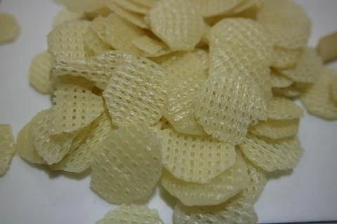 Closeup view of dried chips as fast food usually eaten with tea. Stock Photos