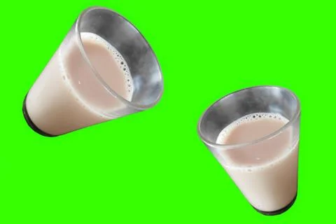 Closeup view of drinking glasses with tea green background Stock Photos