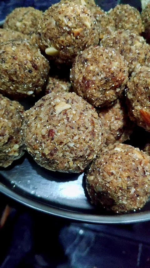 Closeup view of dry fruit laddus showing rich texture and traditional sweet.. Stock Footage 339081769
