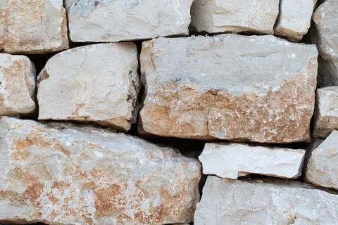 A closeup view of a drystone (drystack) wall filling the frame as a textured  스톡 사진