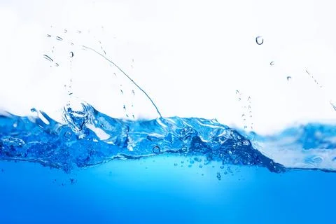 Closeup view of dynamic flowing blue water waves on white background. Liqui.. Stock Photos