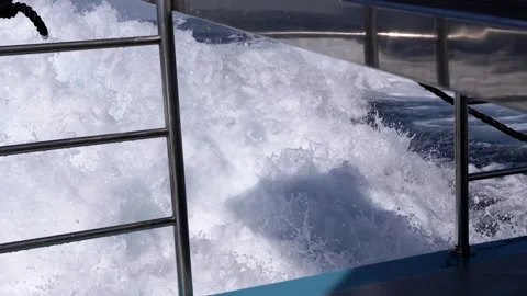 Closeup, View, Dynamic Ocean Waves Crash against a Sturdy Boat Stock Footage 313872537