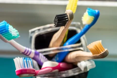 Closeup view of eco-friendly bamboo toothbrush next to window in bathroom Stock-Fotos