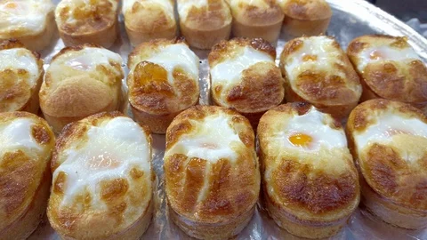 Closeup view of egg bread or Gyeran Bbang at Myeongdong street in Seoul, South Stock Footage 124329926