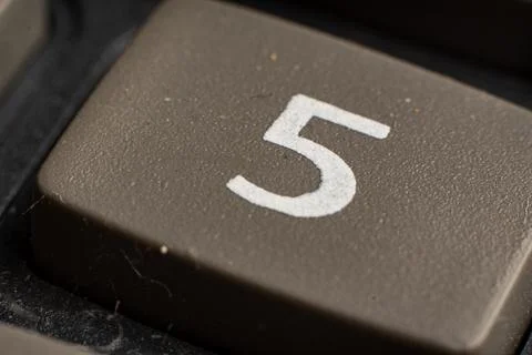 Closeup view of electronic keypad highlighting the number five button used for Stock Photos