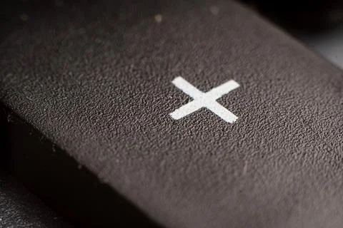 Closeup view of electronic keypad highlighting the plus addition button used for Stock Photos