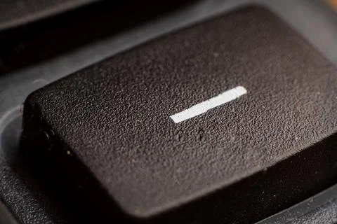 Closeup view of electronic keypad highlighting the minus button used for Stock Photos