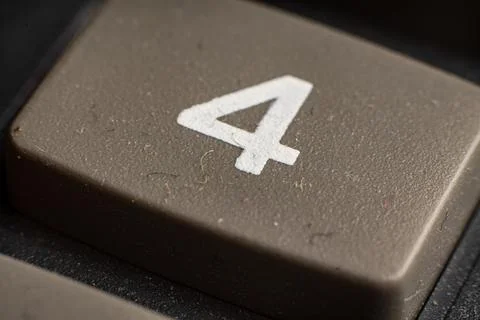 Closeup view of electronic keypad highlighting the number four button used for Stock Photos