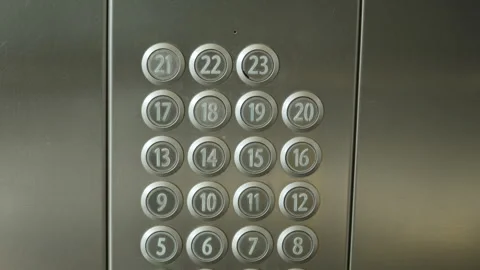 Closeup view of elevator panel with buttons numbered from 1 to 23 on steel wall. Stock Footage 293283566